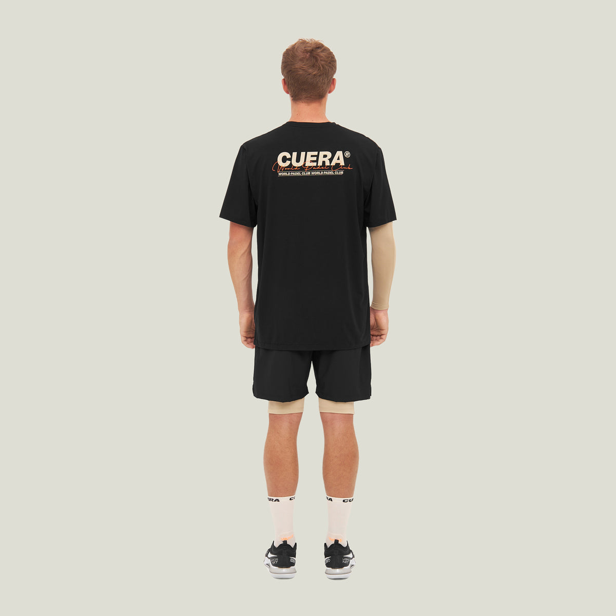 Model wearing Cuera Oncourt Shorts &amp; Light Weight T-Shirt  Black Bundle, back studio view