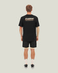 Model wearing Cuera Oncourt Shorts & Light Weight T-Shirt  Black Bundle, back studio view