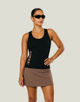 Model wearing Cuera Oncourt Slim Tank Top in Black, front studio view