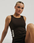 Model wearing Cuera Oncourt Slim Tank Top in Dark Brown, close-up detail on model