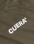 Model wearing Cuera Oncourt Slit Top Light Weight in Army, back studio view
