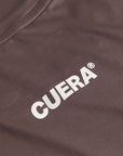 Cuera Oncourt Slit Top SS in Dark Brown, logo print detail
