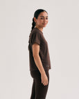 Model wearing Cuera Oncourt Slit Top SS in Dark Brown, front studio view