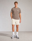 Model wearing Cuera Oncourt Walnut/Off White Uniform Bundle, front studio view