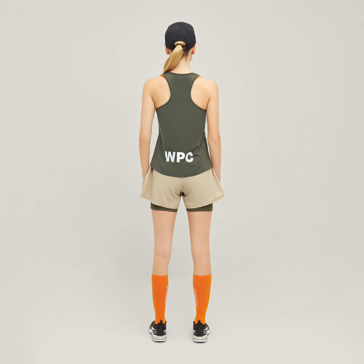 Model wearing Cuera Oncourt WPC Tank in Army, back studio view