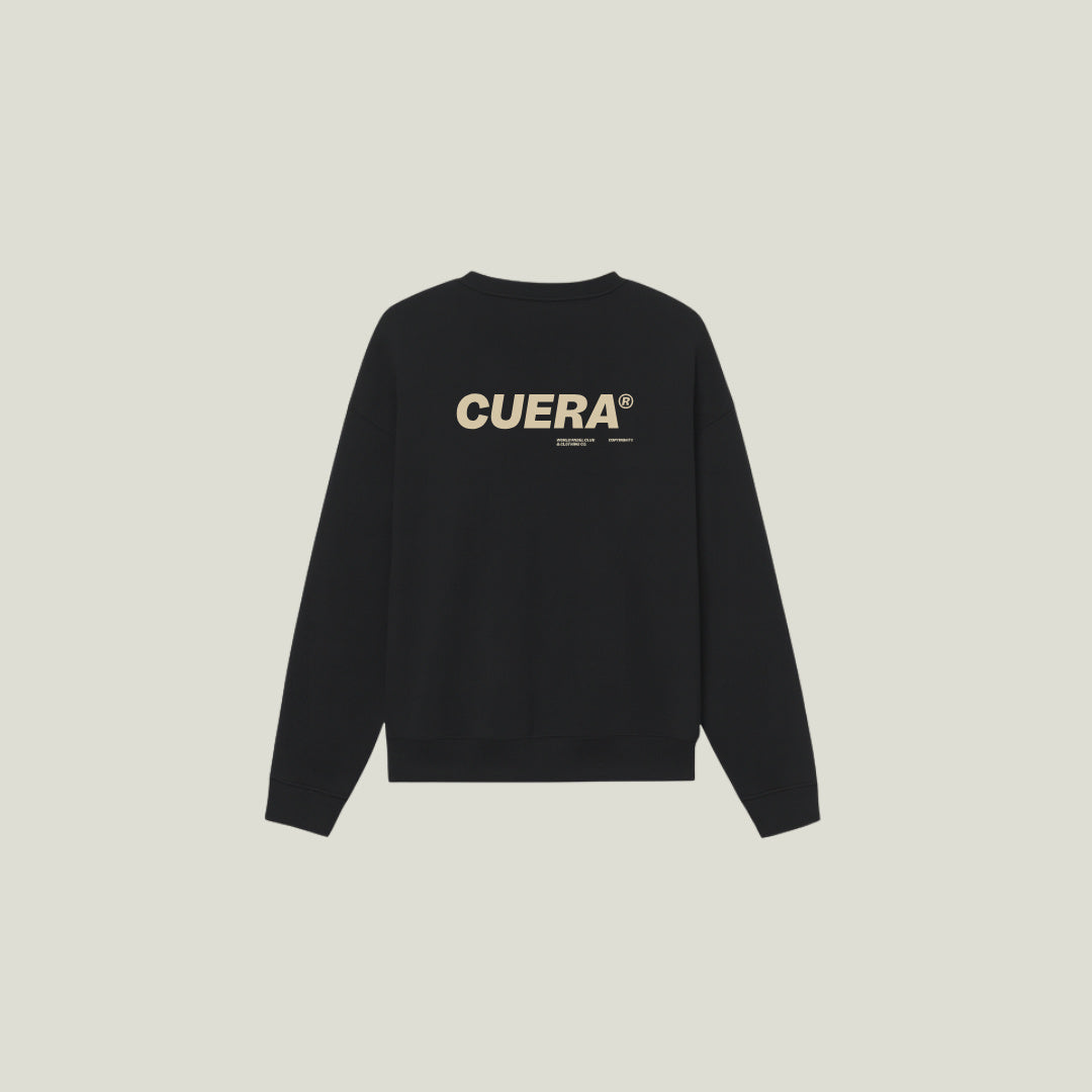 Model wearing Cuera Offcourt Cuera Crew Neck Sweat in Black, front studio view