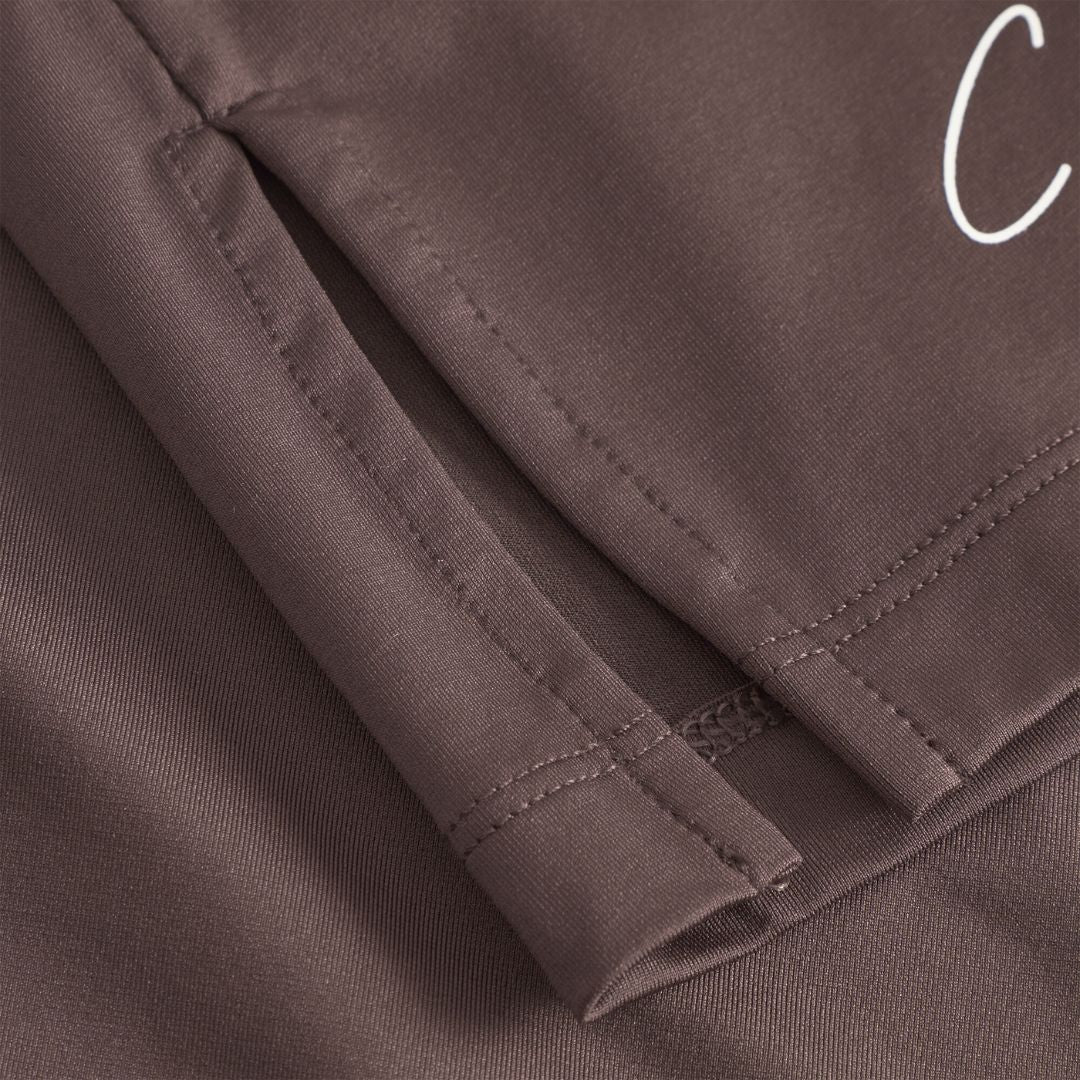 Cuera Slit Top SS & Active Globe Shorts in Dark Brown bundle, logo print detail