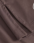 Cuera Slit Top SS & Active Globe Shorts in Dark Brown bundle, logo print detail