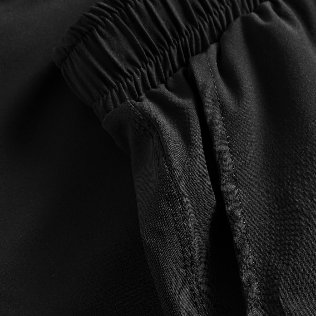 Fabric and seam detail of Cuera Women's Active Globe Shorts in Black